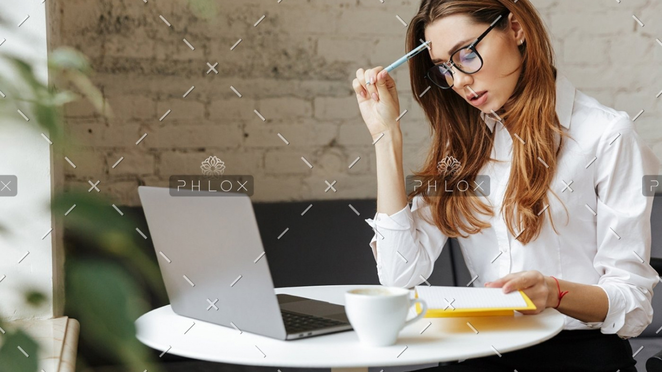 demo-attachment-407-thoughtful-business-woman-indoors-using-laptop-P5HYUQX